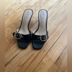 Coach Black Slide Sandals with Gold Buckle