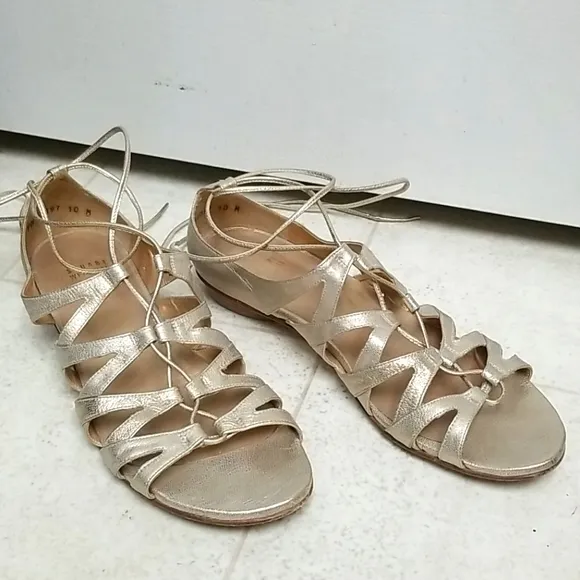 STUART WEITZMAN strappy gold leather sandals